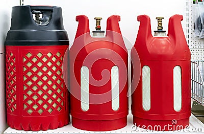 Plastic red gas cylinders for domestic use Stock Photo