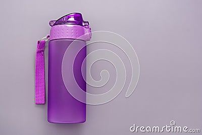 Plastic reusable water bottle over grey background, drinking water Stock Photo