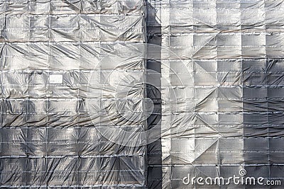 Plastic sheeting on scaffolding Stock Photo