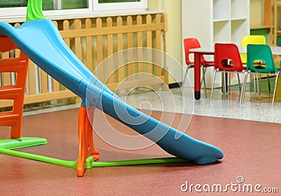 Plastic slide in the playground of a kindergarten Stock Photo