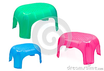 Plastic stool for bathroom or kitchen. Children chair. Green, blue, and pink plastic stool isolated on white background. Stepping Stock Photo