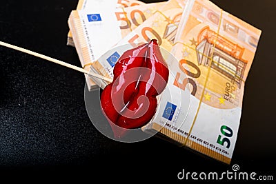 red lips on euro banknote, on black, lips plastic surgery Stock Photo