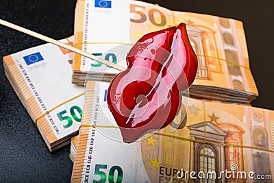 view of woman red lips on euro banknote, isolated on black, lips plastic surgery Stock Photo