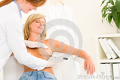 Plastic surgery doctor draw line patient breast Stock Photo