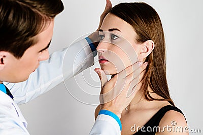 Plastic surgery doctor, patient inspection and consultation Stock Photo