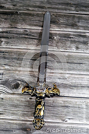 A plastic sword toy game for children, a sword is an edged, bladed weapon intended for manual cutting or thrusting. Its blade, Stock Photo