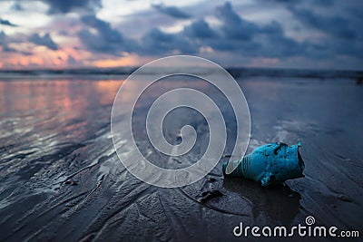 Plastic trash littering the ocean at the beach during sunset, Koh Lanta, Thailand Stock Photo