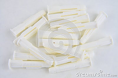 Plastic wall plugs for fastener screw. Material made of plastic for construction. Home equipment for repairing Stock Photo