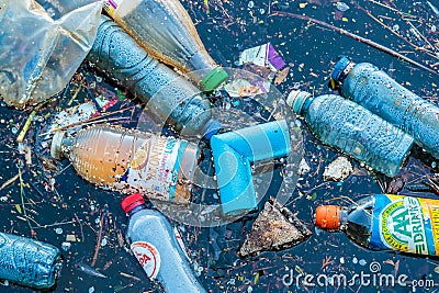 Plastic waste floating in a canal in Amsterdam, The Netherlands Editorial Stock Photo