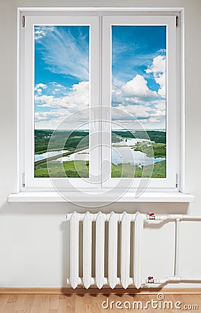 Plastic window and radiator Stock Photo