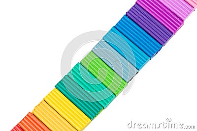 Plasticine colorful sticks isolated over white background. creative photo Stock Photo