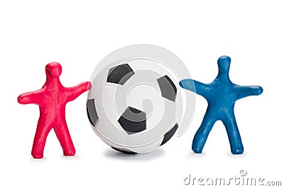 Plasticine small people soccer players with ball Stock Photo