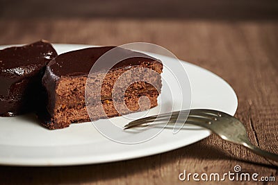 A plate with argentinean-uruguayan alfajores on a wooden table and dark background Stock Photo