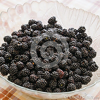 Plate with berries black blackberries. Fruits berries on the tab Stock Photo