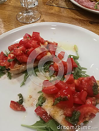 Plate of bruschetta with tomato, basil, oil and garlic Stock Photo