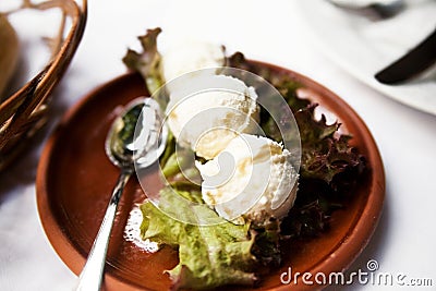 Plate with cheese kaimak on the table Stock Photo