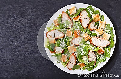 Plate of chicken caesar salad, top view Stock Photo