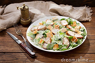Plate of chicken caesar salad Stock Photo