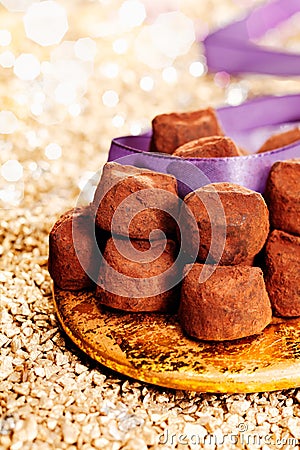 Plate of chocolate confectionery with ribbon Stock Photo