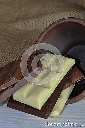 a plate with chocolate is lying on a burlap on a white table Stock Photo