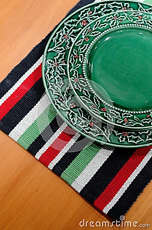 Plate and colorful table cloth Stock Photo