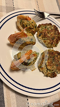 plate of 3 crabmeat stuffed jumbo shrimp, & 2 crabcakes seafood heaven Stock Photo