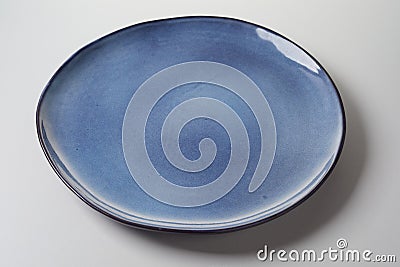 Plate with creative blue enamel Stock Photo