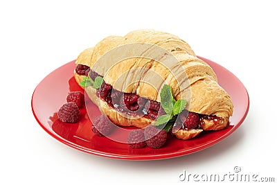 Plate with croissant with raspberry jam isolated on white background Stock Photo