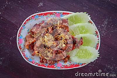 Plate of Deep Fried Crispy Pork Belly Cooked with Garlic Stock Photo