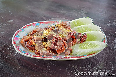 Plate of Deep Fried Crispy Pork Belly Cooked with Garlic Stock Photo