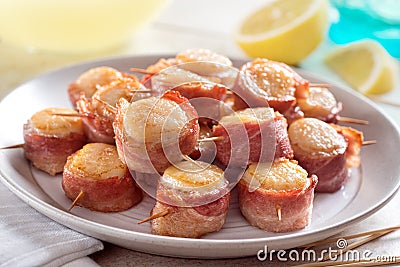 A plate of delicious bacon wrapped scallops Stock Photo