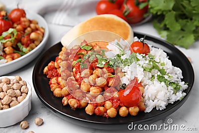 Plate with delicious chickpea curry on table, closeup Stock Photo