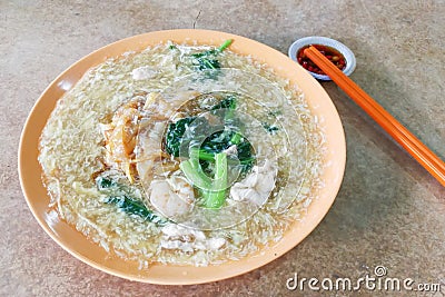 Plate of delicious fried kuey teow noodle Chinese Cantonese style Stock Photo