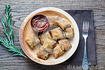 Plate with fried ravioli on the wooden board Stock Photo