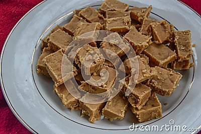 Homemade Peanut Butter Fudge on a White Plate Stock Photo