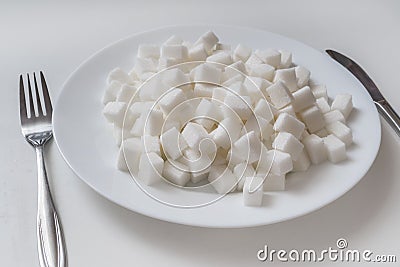 Plate full of sugar cubec. Unhealthy eating concept Stock Photo