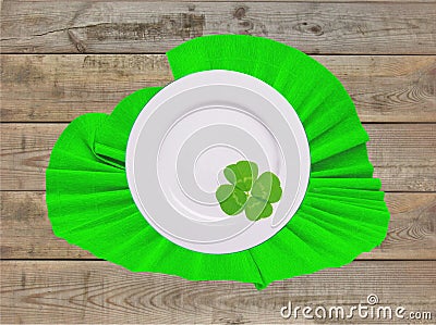 Plate on green napkin with clover leaf for St Patricks Day Stock Photo