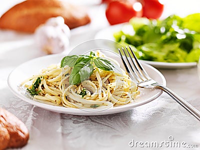 Plate of italian spaghetti with pesto sauce Stock Photo