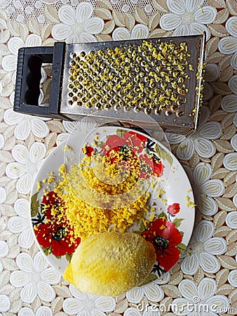 Plate with lemon, citron and grater on table Stock Photo