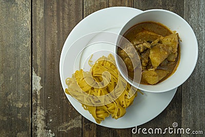 Roti Jala with a bowl of chicken curry Stock Photo