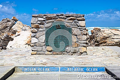 The plate marking the point of Cape Agulhas, the southernmost point of africa. The indian ocean is on the right, the Atlantic Stock Photo