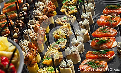 Plate meat, fish, vegetable canapes on a festive wedding table outdoor Stock Photo