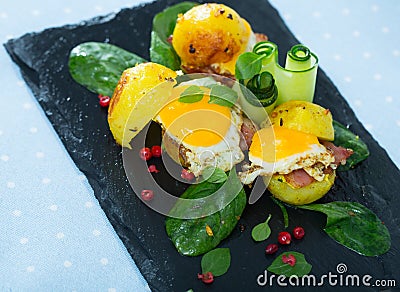 Plate with mini burgers from scrambled quail eggs with potatoes Stock Photo
