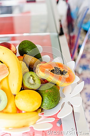 Plate of mixed exotic fruit on the kitchen table Stock Photo