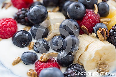 Plate of mixed fruits with yogurt Stock Photo