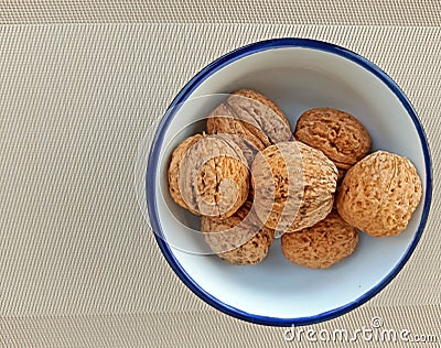 A plate of nuts on canvas background Stock Photo