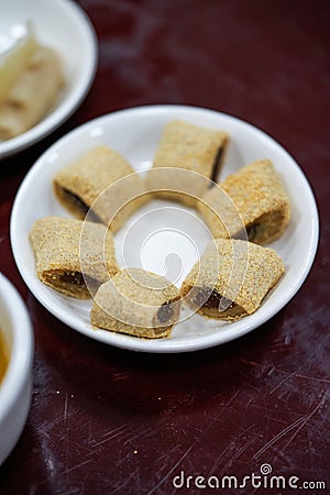 A plate of old Beijing traditional dessert snacks, donkey rolling Stock Photo