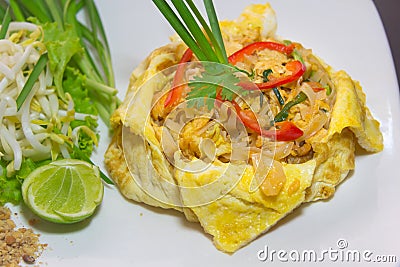 Plate of Pad Thai or phat Thai in omelette Stock Photo