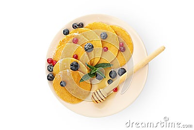 Plate with pancakes, dipper honey and berries isolated on white background Stock Photo