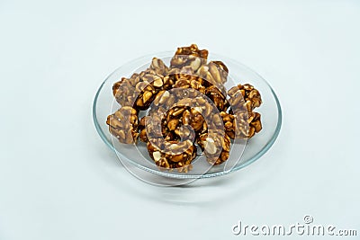 A Plate of Peanut Ladoo for Makar Sankranti which is Peantus dipped in Sweet Jaggery gud Stock Photo